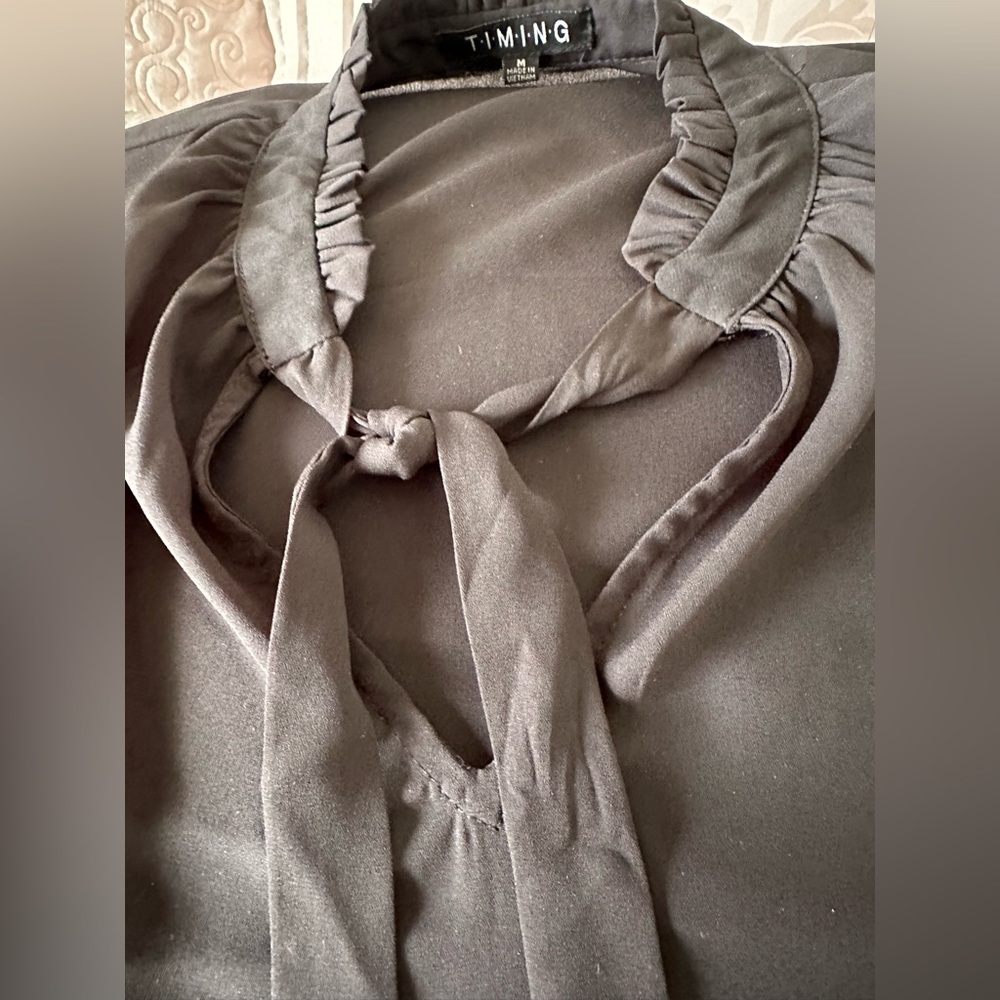 Semi sheer sexy blouse. Black size medium. Timing
